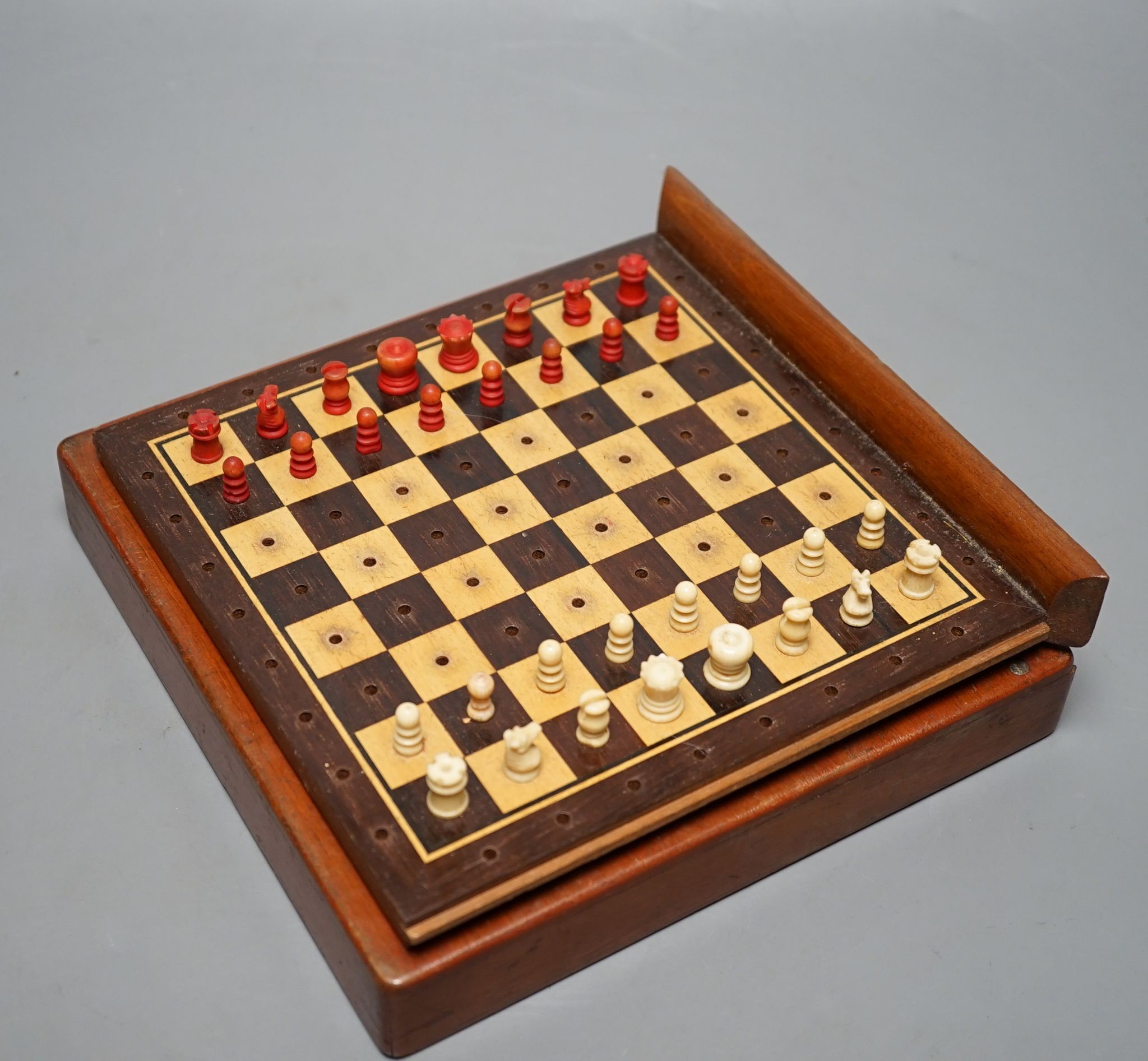 Two boxed chess sets, one turned wood, the other bone